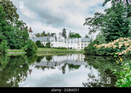 Velke Losiny Castle in Czech spa town,East Bohemia,Jeseniky Mountains,Czech Republic.Romantic Renaissance chateau with sgraffito decoration reflected Stock Photo