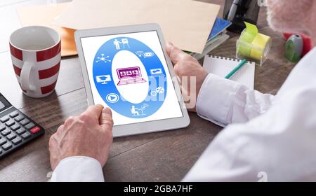Webinar concept shown on a tablet held by a man Stock Photo
