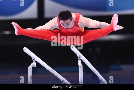 03 August 2021, Japan, Tokio: Gymnastics: Olympics, parallel bars, men, final at Ariake Gymnastics Centre. Hao You from China in action. Photo: Marijan Murat/dpa Stock Photo