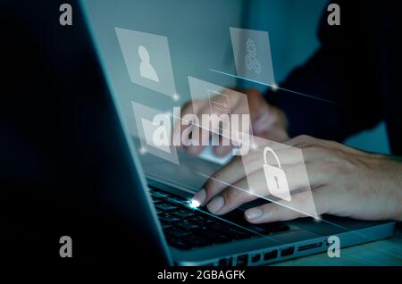 Businessman using computer laptop document management concept working with icons on a virtual screen. Stock Photo