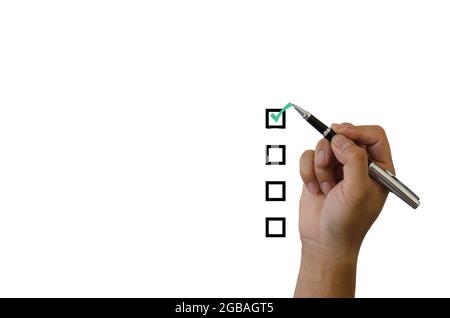 hand holding a green checkmark on a white background Stock Photo