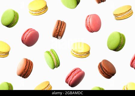 Levitation colorful macaroons isolated on white background. Sweet And Colourful French cookies Macaroons. Pattern. Sweet  candies food background. Stock Photo