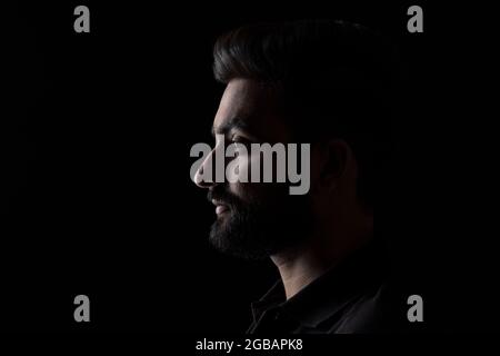 PORTRAIT OF A BEARDED MAN LOOKING STRAIGHT Stock Photo