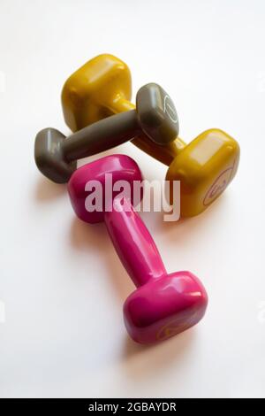 Colorful dumbbells set isolated on white background Stock Photo