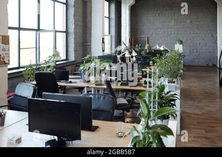 Large classroom or computer class or open space office with monitors on desks Stock Photo
