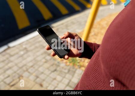 African american man in city using smartphone Stock Photo