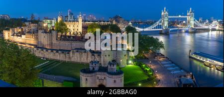 View of the Tower of London, UNESCO World Heritage Site, and Tower Bridge from Cheval Three Quays at dusk, London, England, United Kingdom, Europe Stock Photo