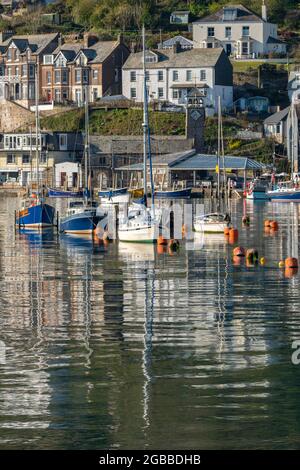 Boats moored in Looe's pretty harbour at dawn in spring, Looe, Cornwall, England, United Kingdom, Europe Stock Photo