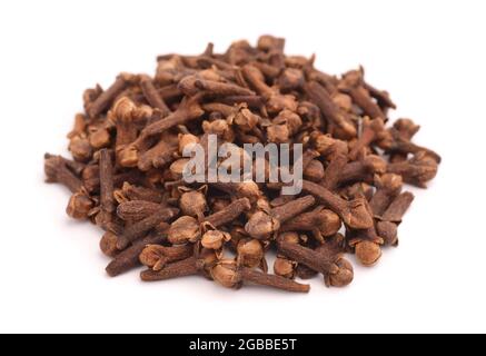 Heap of dried buds of clove isolated on white Stock Photo