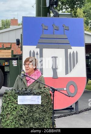 03 August 2021, Schleswig-Holstein, Husum: Defence Minister Annegret Kramp-Karrenbauer (CDU) speaks during her visit to the Special Engineer Regiment 164 'North Friesland' in Olderup near Husum. She wanted to find out about the basic training there in the new Voluntary Military Service in Homeland Security. Photo: Birgitta von Gyldenfeldt/dpa Stock Photo