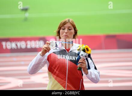 Tokyo, Japan. 03rd Aug, 2021. Award ceremony, victory ceremony, Kristin PUDENZ (GER/2nd place) looks at her silver medal, facial expressions, silver, medal, jubilation, cheering, joy, cheers, athletics, women's discus throw, women's discus throw final, on 08/02/2021 Olympic Summer Games 2020, from 23.07. - 08.08.2021 in Tokyo/Japan. Credit: dpa/Alamy Live News Stock Photo