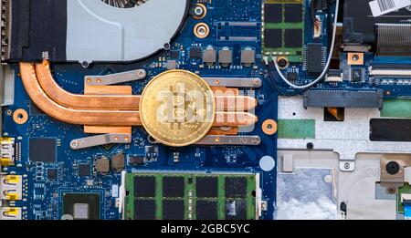 gold bitcoin coin and circuits behind it. next generation investment cryptocurrency. Stock Photo