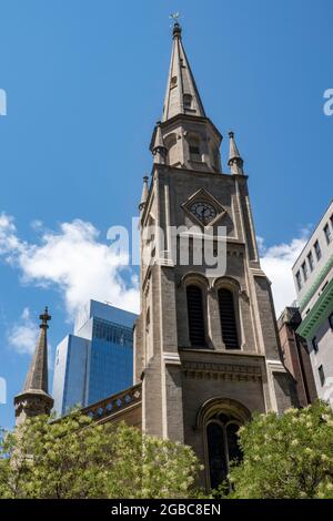 Marble Collegiate Reformed Church Spire looms over Fifth Avenue, New York City, USA Stock Photo