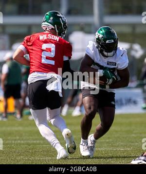 New York Jets' Michael Carter (32) celebrates with teammates after