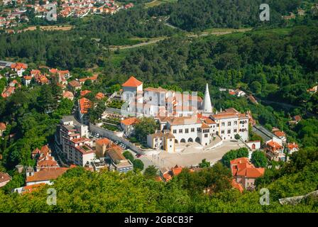 Town with white buildings and red tiles shot from afar. The Palace of Sintra with an empty square in the morning. Peaceful city is asleep Stock Photo