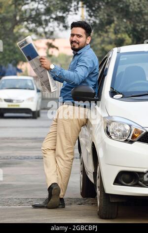 Indian Business Man Reading Newspaper Outdoor Stock Photo