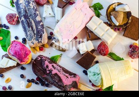 varied ice cream with fruits and berries in chocolate top view Stock Photo