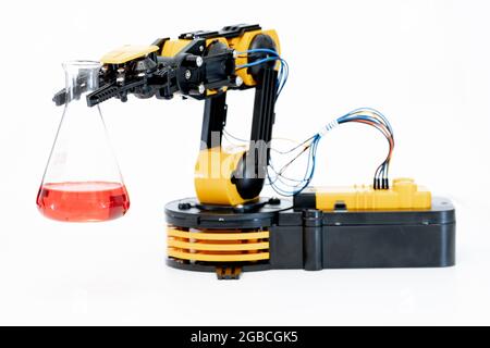 Laboratory robot with flask in robotics science laboratory Stock Photo