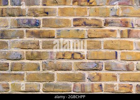 Close up view of Yellow brick wall pattern / background in stretcher cousre kent uk Stock Photo