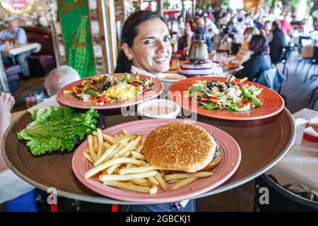 Huntsville Alabama,Rosie's Mexican Cantina,restaurant inside interior,woman female waitress server employee working worker,holds holding balances bala Stock Photo