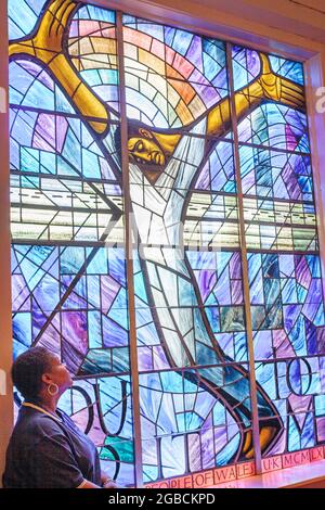 Birmingham Alabama,16th Street Baptist Church,inside interior Black History Civil Rights Movement 1963 bombing,stained glass window woman looking Stock Photo