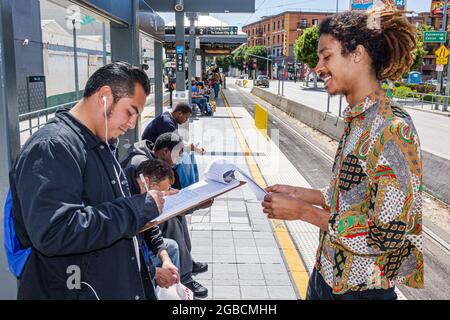 Los Angeles California,LA County Metro Rail,urban rail system public transportation Gold Line Pico Station platform,Hispanic writing completing Black Stock Photo