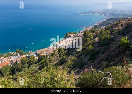 Taormina, Messina, Sicily, Italy. High angle view over the town and Ionian Sea from the clifftop Chapel of Madonna della Rocca. Stock Photo