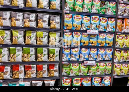 Johannesburg South Africa,Rosebank The Zone Mall Woolworths,grocery store supermarket store interior inside shelves,display sale bags potato chips cri Stock Photo