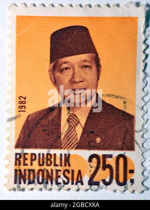 postage stamp printed in Indonesia with portrait image of Suharto the Indonesian second president, Value 250 Rp - Indonesian rupiah, series, circa 198 Stock Photo