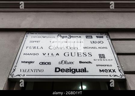 Krakow, Poland - August 28, 2018: Poster with many fashion clothing brands like Armani, Valentino, Mango, Furla in Krakow, Poland Stock Photo
