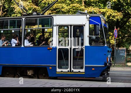 Krakow, Poland - August 29, 2018: Tram circulating with passengers in the center of Krakow, Poland Stock Photo