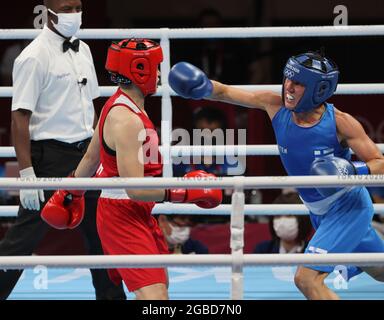 Tokyo, Kanto, Japan. 3rd Aug, 2021. Finland Olympic Team's only medal winner in 2016 Rio games, is repeating as a medal winner in 2020 Tokyo games. 'Boxer Mum' aka MIRA MARJUT JOHANNA POTKONEN, 40, edging out younger rival Turkey's ESRA YILDIZ, 24, who could be her daughters age, in a win by points 3-2 during the quarterfinal match for Women's Light (57-60kg) Boxing at the 2020 Tokyo Summer Olympics. Potkonen will face Brazil's B. Ferreira in the semifinals Thursday. Mira will be oldest lady boxer to win a medal. (Credit Image: © Scott Mc Kiernan/ZUMA Press Wire) Stock Photo