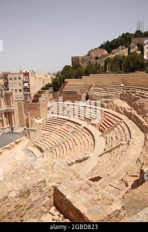 Roman theatre, Cartagena, Spain. Stage, columns and seats carved out of stone in the centre of the city.  Build built in the 1st century B.C. Stock Photo