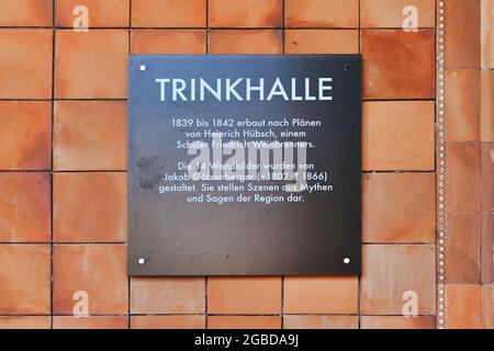 Baden-Baden, Germany - July 2021: Information board at entrance of historic pump house called 'Trinkhalle'