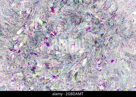 Christmas background with tinsel. Silvery background and beautiful bokeh. Stock Photo