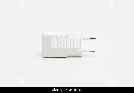 Used usb smartphone charger on isolated white background Stock Photo