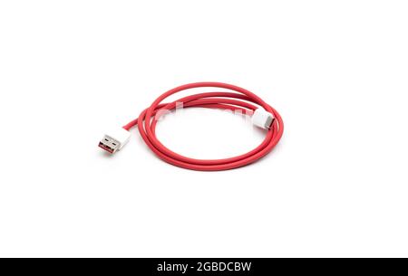 Red wire with type c white male connector usb cable on isolated white background Stock Photo