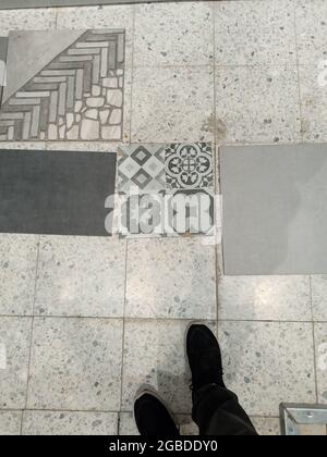 Various floor tiles offered to customers in the building materials company. Stock Photo