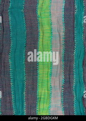 Striped knitted cotton fabric matte texture top view. Colorful stripes knitwear background. Fashion multicolor clothes trend Handmade blog backdrop te Stock Photo