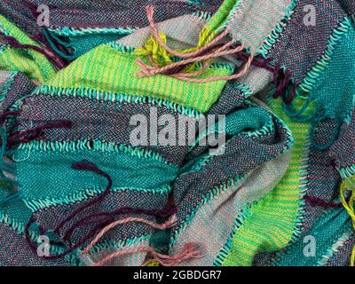 Striped knitted cotton fabric fringe texture top view. Colorful stripes knitwear background. Fashion multicolor clothes trend Handmade blog backdrop t Stock Photo