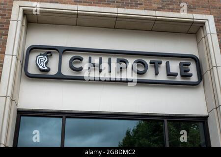 Kirkland, WA USA - circa July 2021: Low angle view of a Chipotle Mexican fast casual food establishment. Stock Photo