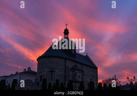 Orthodox Church in Kamyanets-Podilsky in Ukraine at SUnset Sky Background Stock Photo
