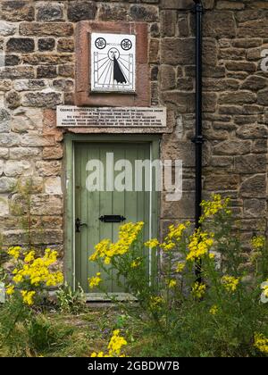 Entranceto Dial Cottage with sundial by the Engineer and railway pioneer at Forest Hall in North Tyneside, UK Stock Photo