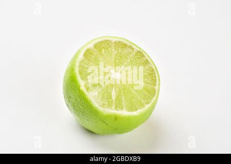 Half Cut Lime Isolated On White Background With Clipping Path Stock Photo