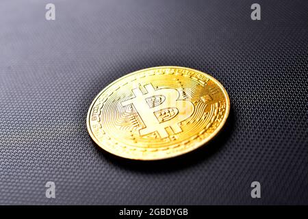 Golden Bitcoin On Dark Background Stock Photo