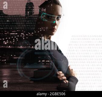Portrait of a futuristic brunette woman posing over the urban landscape Stock Photo