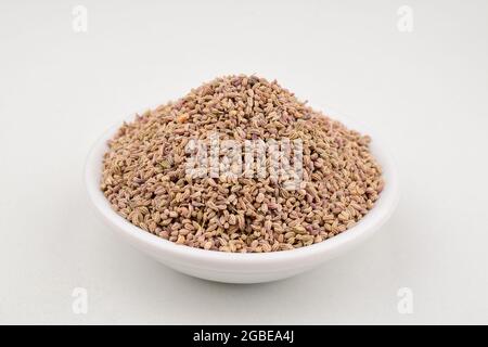 Ajwain Or Bishop Seeds In Bowl On White Background Stock Photo