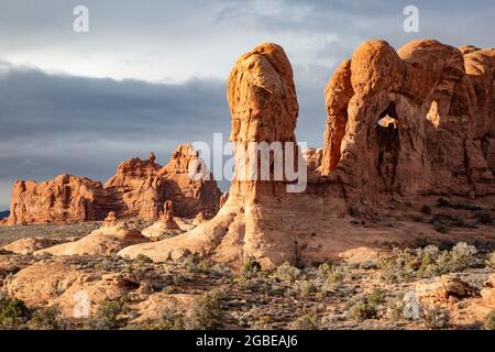 Sandstone rock formations (near Double Arch), and Garden of Eden rock formations in background, The Windows Section, Arches National Park, Moab, Utah Stock Photo
