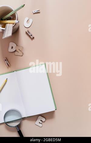 Creative workplace top view. Education, learning, study stationary on the table with copy space. Blank paper notepad, diary, plan flat lay Stock Photo