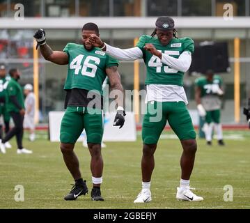 August 3, 2021, Florham Park, New Jersey, USA: New York Jets linebackers Hamsah  Nasirildeen (45) and Milo Eifler (46) dance to the tones prior to practice  at the Atlantic Health Jets Training